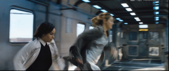 Christina and Tris jumping off the train 